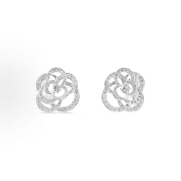 CHANEL FIL DE CAMELIA earrings featuring a hollowed-out camellia design, made of 18K white gold set with diamonds